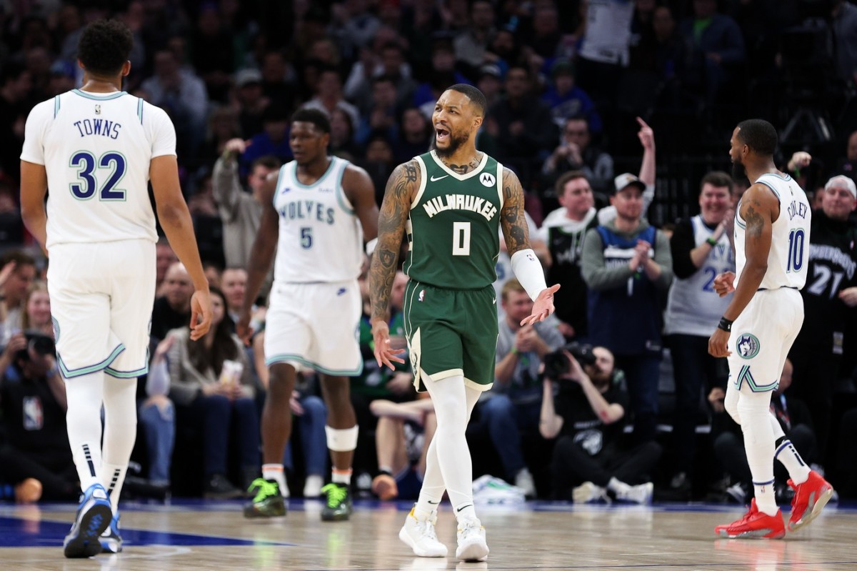 Feb 23, 2024; Minneapolis, Minnesota, USA; Milwaukee Bucks guard Damian Lillard (0) reacts during the first half against the Minnesota Timberwolves at Target Center.